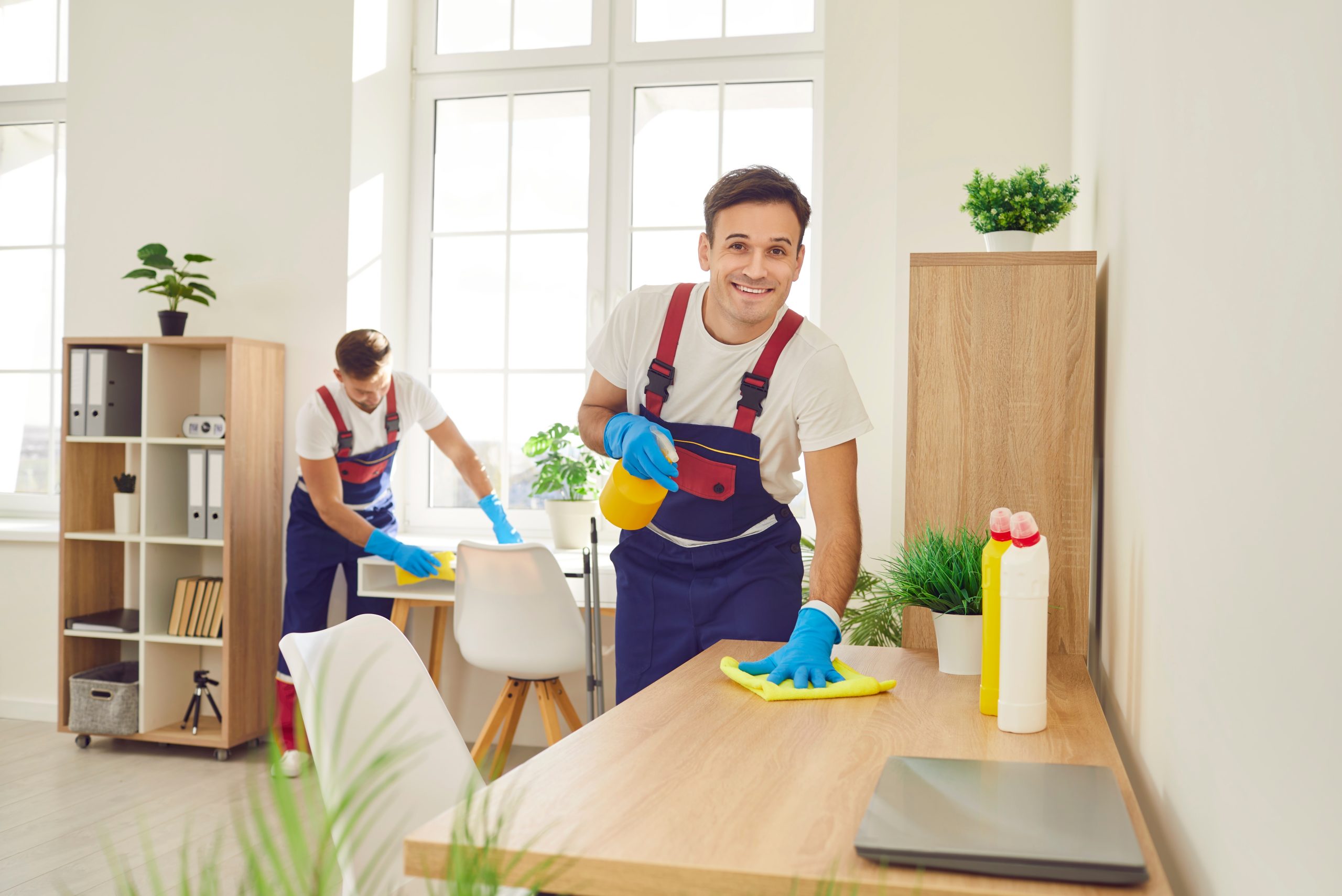  Cleaners sanitizing office furniture 
